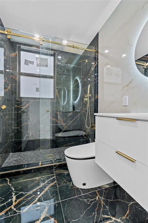 7141 Mariana Court Boca Raton, FL 33433 - Photo 36 of 68 a bathroom with a sink toilet and shower