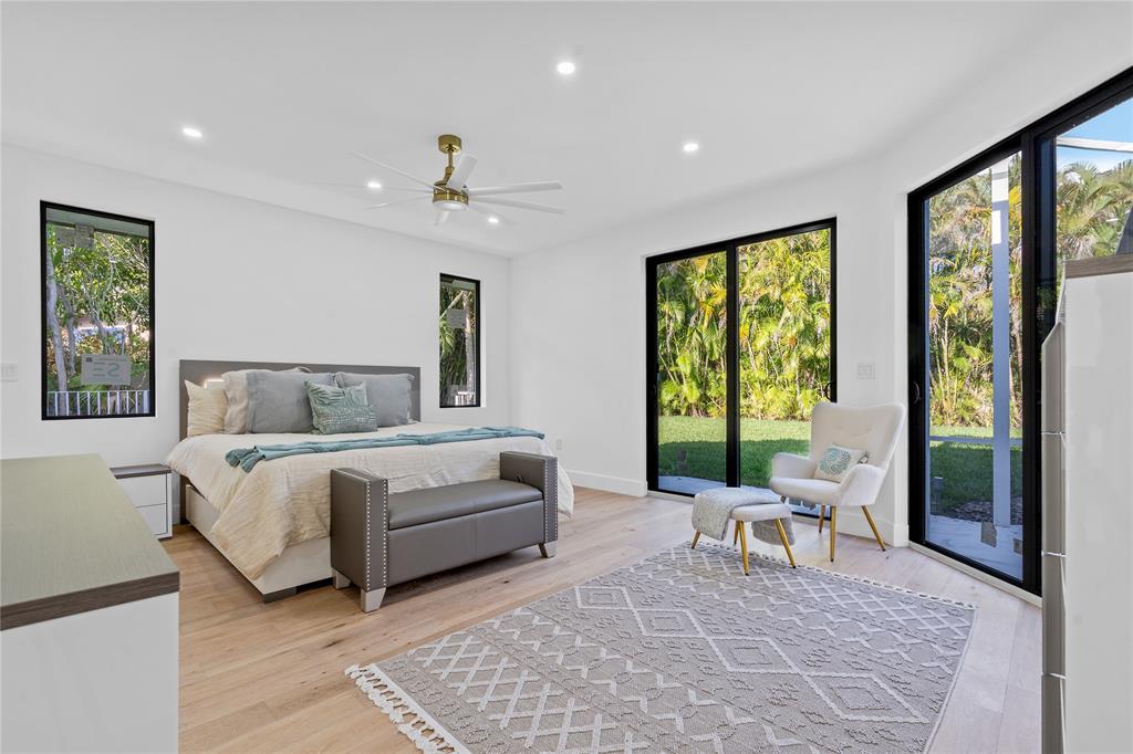 7141 Mariana Court Boca Raton, FL 33433 - Photo 40 of 68 a living room with furniture and large windows