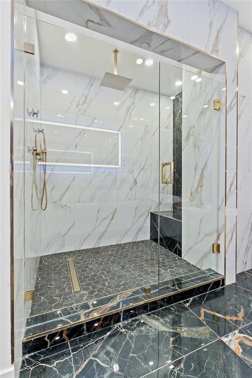 7141 Mariana Court Boca Raton, FL 33433 - Photo 45 of 68 a bathroom with a granite countertop shower and a sink