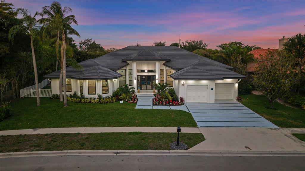 7141 Mariana Court Boca Raton, FL 33433 - Photo 5 of 68 a front view of a house with a yard