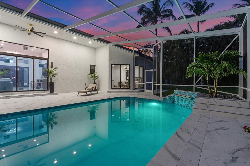 7141 Mariana Court Boca Raton, FL 33433 - Photo 65 of 68 a view of a swimming pool with a porch