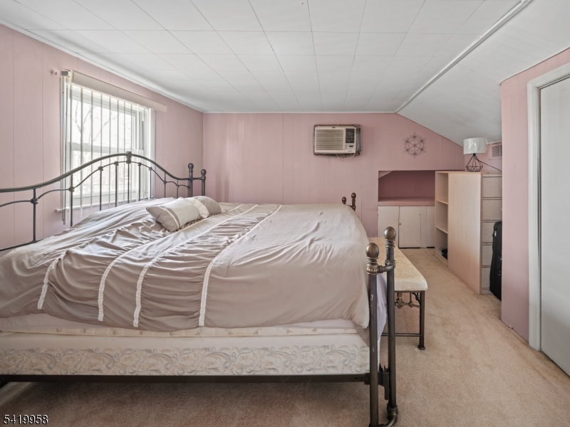 544 Goffle Hill Road Hawthorne, NJ 07506 - Photo 13 of 21 a bedroom with a bed and a window