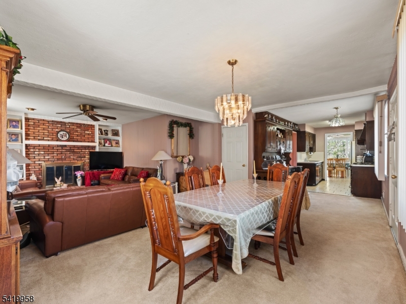 544 Goffle Hill Road Hawthorne, NJ 07506 - Photo 2 of 21 a dining room with furniture and chandelier