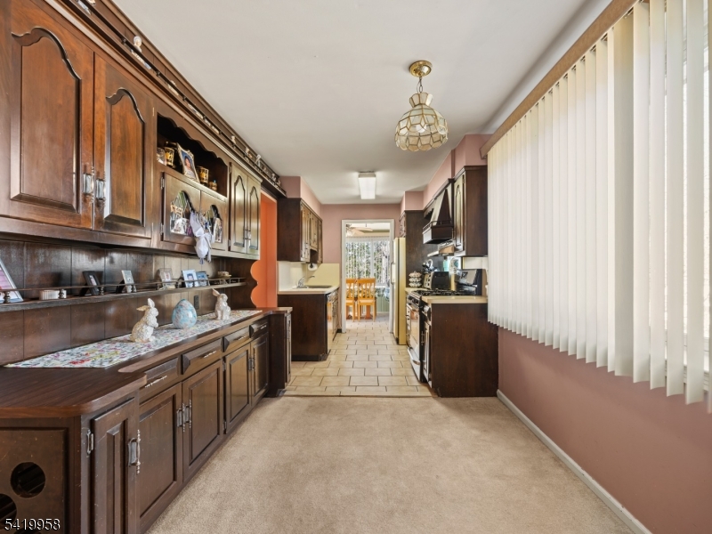 544 Goffle Hill Road Hawthorne, NJ 07506 - Photo 4 of 21 a kitchen with stainless steel appliances granite countertop a stove and cabinets