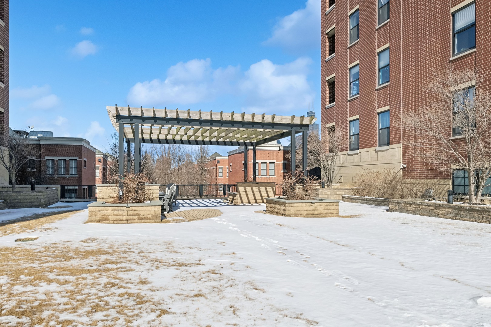 833 West 15th Place, Unit 511 Chicago, IL 60608 - Photo 16 of 16 a view of a building with a bench in a city