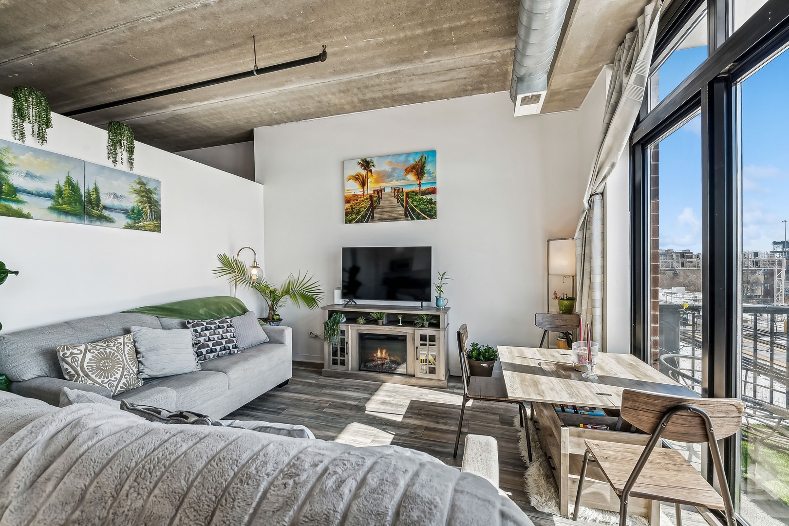 833 West 15th Place, Unit 511 Chicago, IL 60608 - Photo 7 of 16 a view of a livingroom with furniture and a flat screen tv