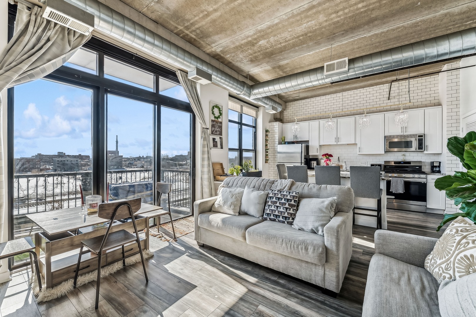 833 West 15th Place, Unit 511 Chicago, IL 60608 - Photo 8 of 16 a living room with furniture and a large window