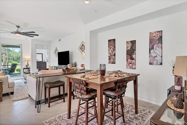 a spacious bedroom with a large bed and a flat tv screen