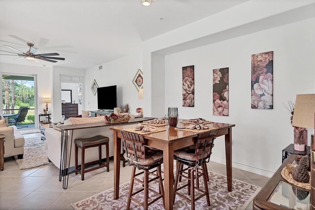 14149 Poppy Field Loop, Unit 6011 Punta Gorda, FL 33955 - Photo 12 of 63 a view of a dining room with furniture and a livingroom