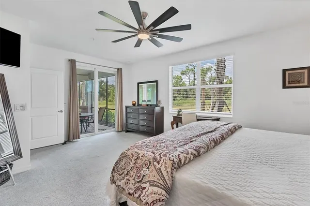 a bedroom with bed and painting on the wall