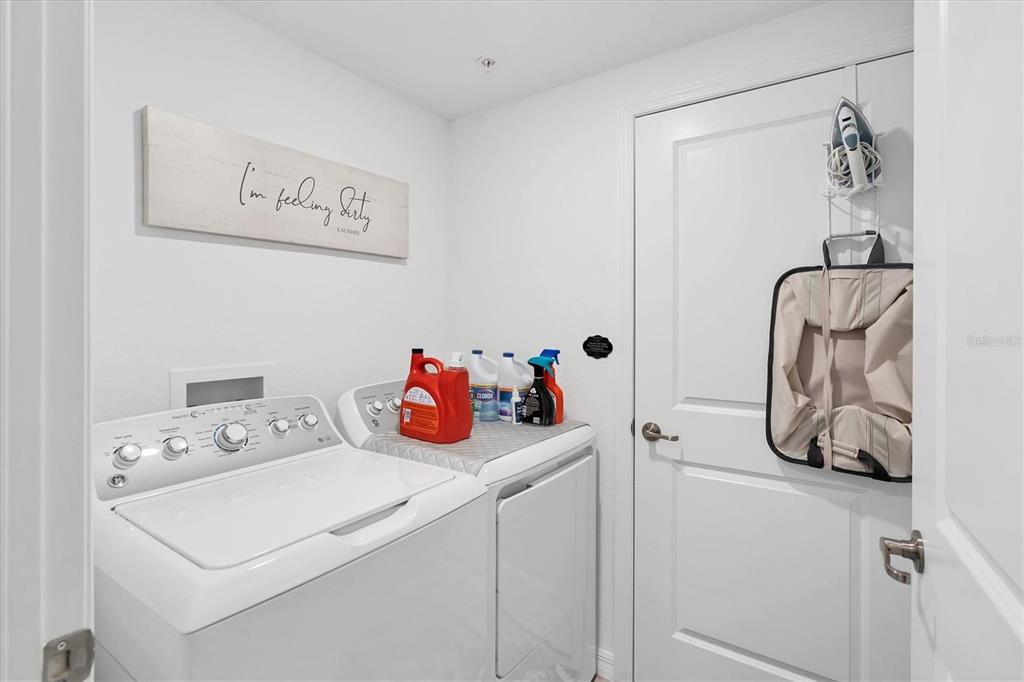 14149 Poppy Field Loop, Unit 6011 Punta Gorda, FL 33955 - Photo 24 of 63 a utility room with dryer and washer
