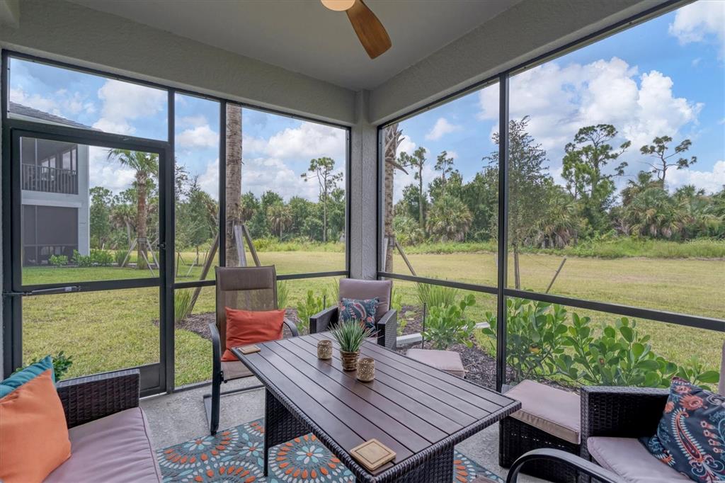 14149 Poppy Field Loop, Unit 6011 Punta Gorda, FL 33955 - Photo 26 of 63 a view of a city from a balcony with furniture