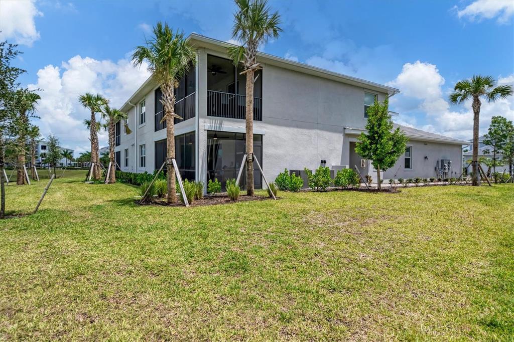 14149 Poppy Field Loop, Unit 6011 Punta Gorda, FL 33955 - Photo 33 of 63 a view of a house with a yard