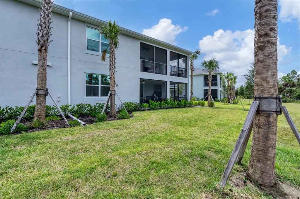 14149 Poppy Field Loop, Unit 6011 Punta Gorda, FL 33955 - Photo 34 of 63 a view of a house with a yard