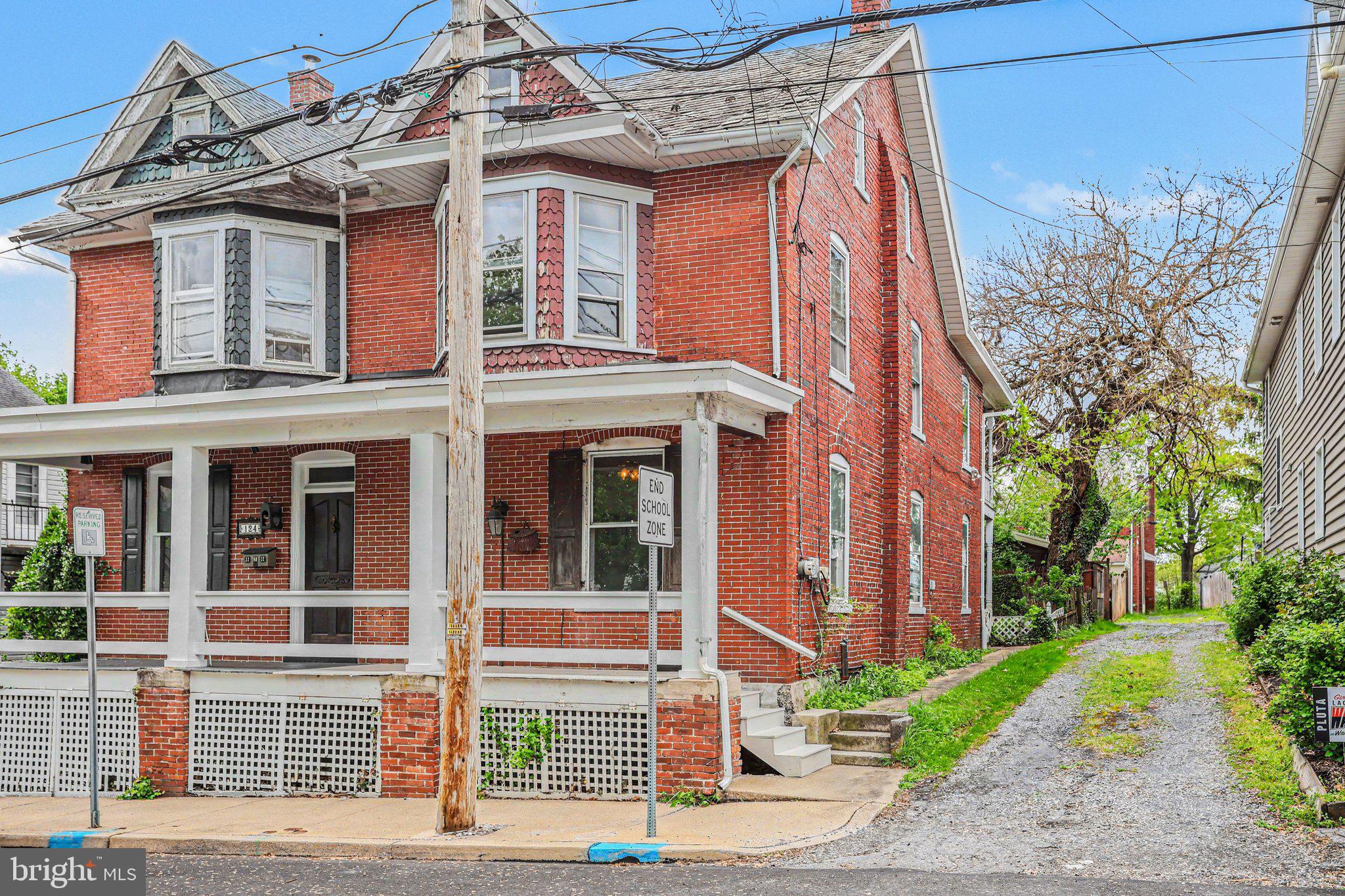 122 South Cedar Street Lititz, PA 17543 - Photo 2 of 23 a view of a brick building next to a yard