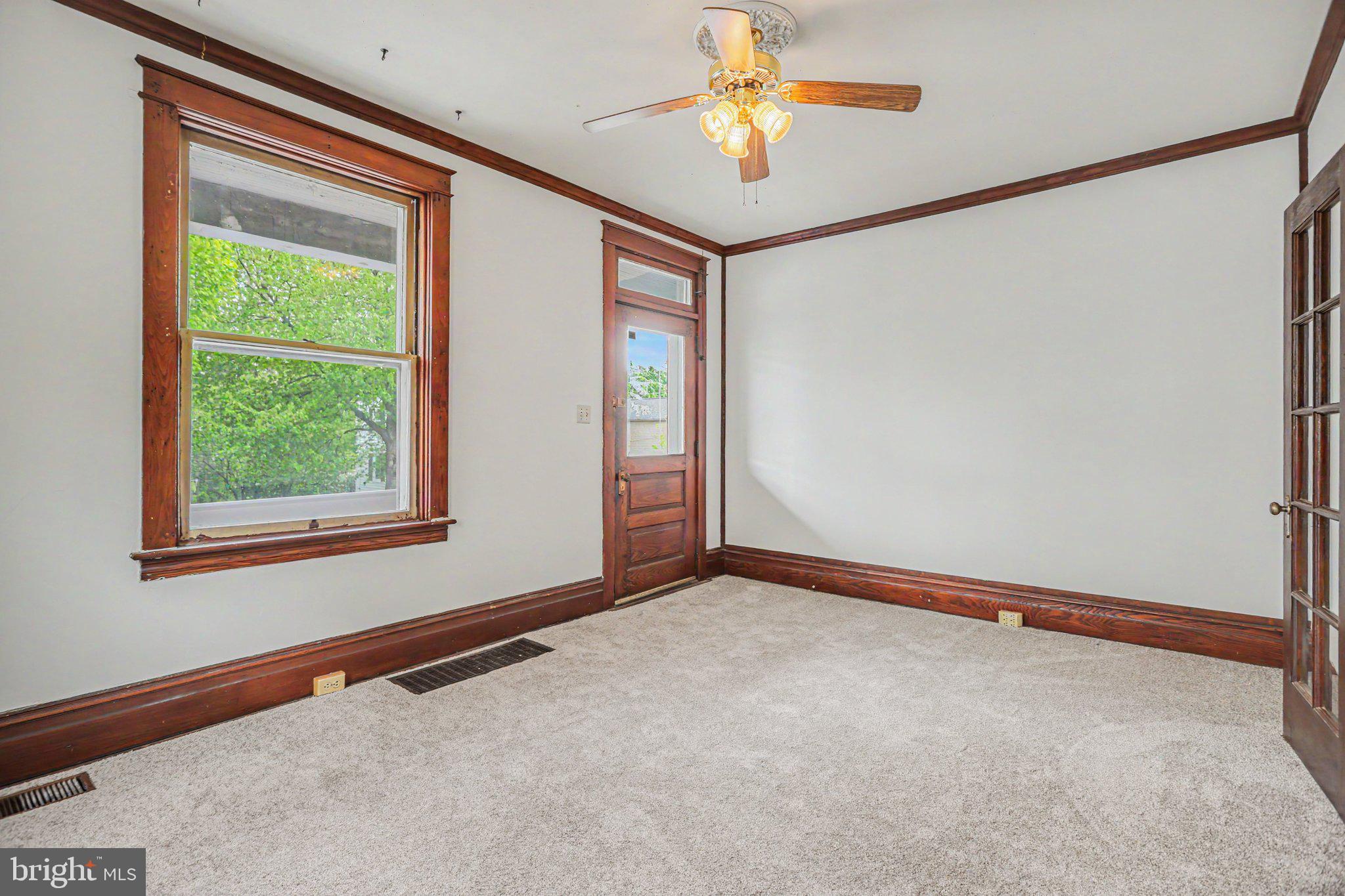 122 South Cedar Street Lititz, PA 17543 - Photo 3 of 23 an empty room with windows and fan