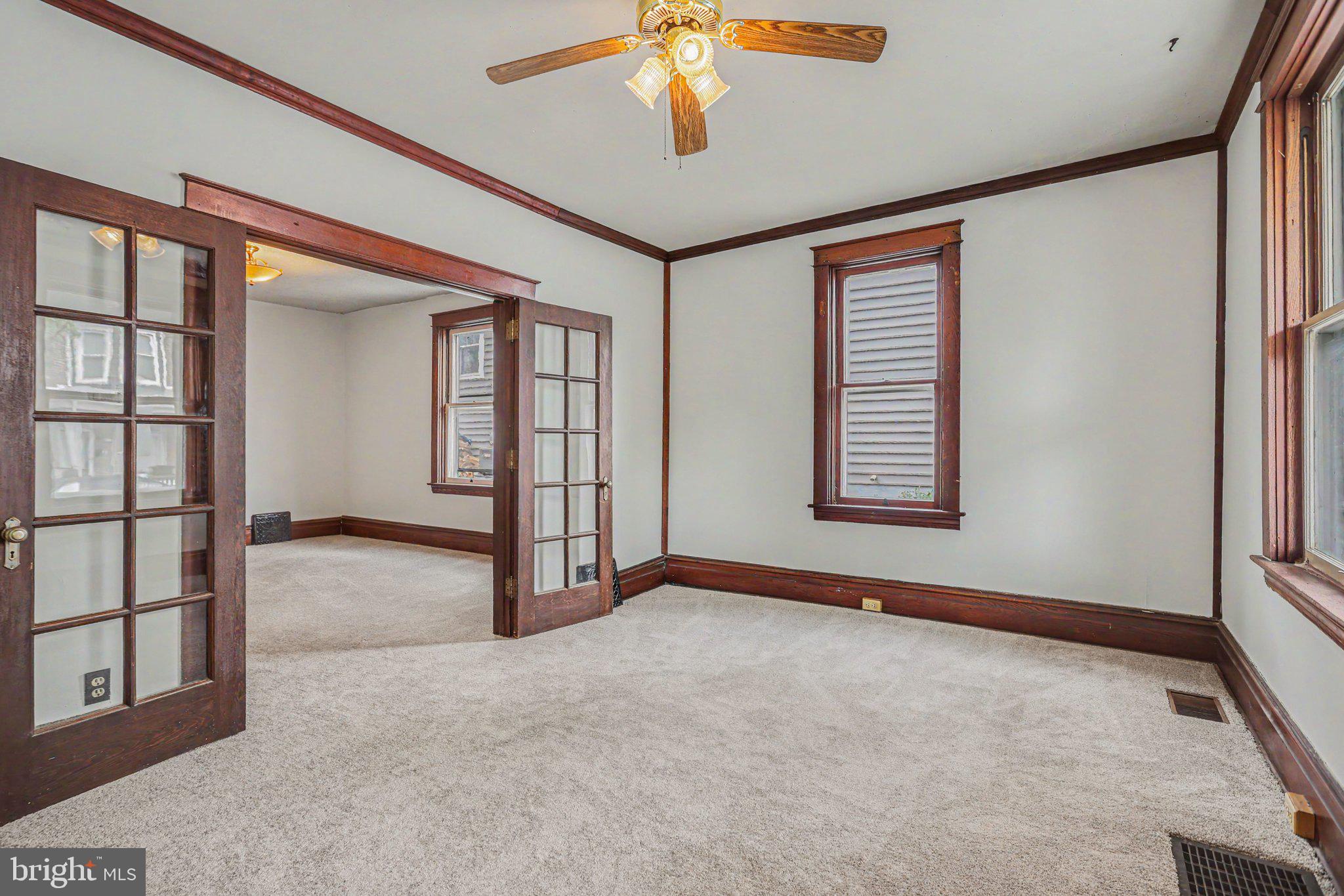 122 South Cedar Street Lititz, PA 17543 - Photo 5 of 23 an empty room with windows and ceiling fan