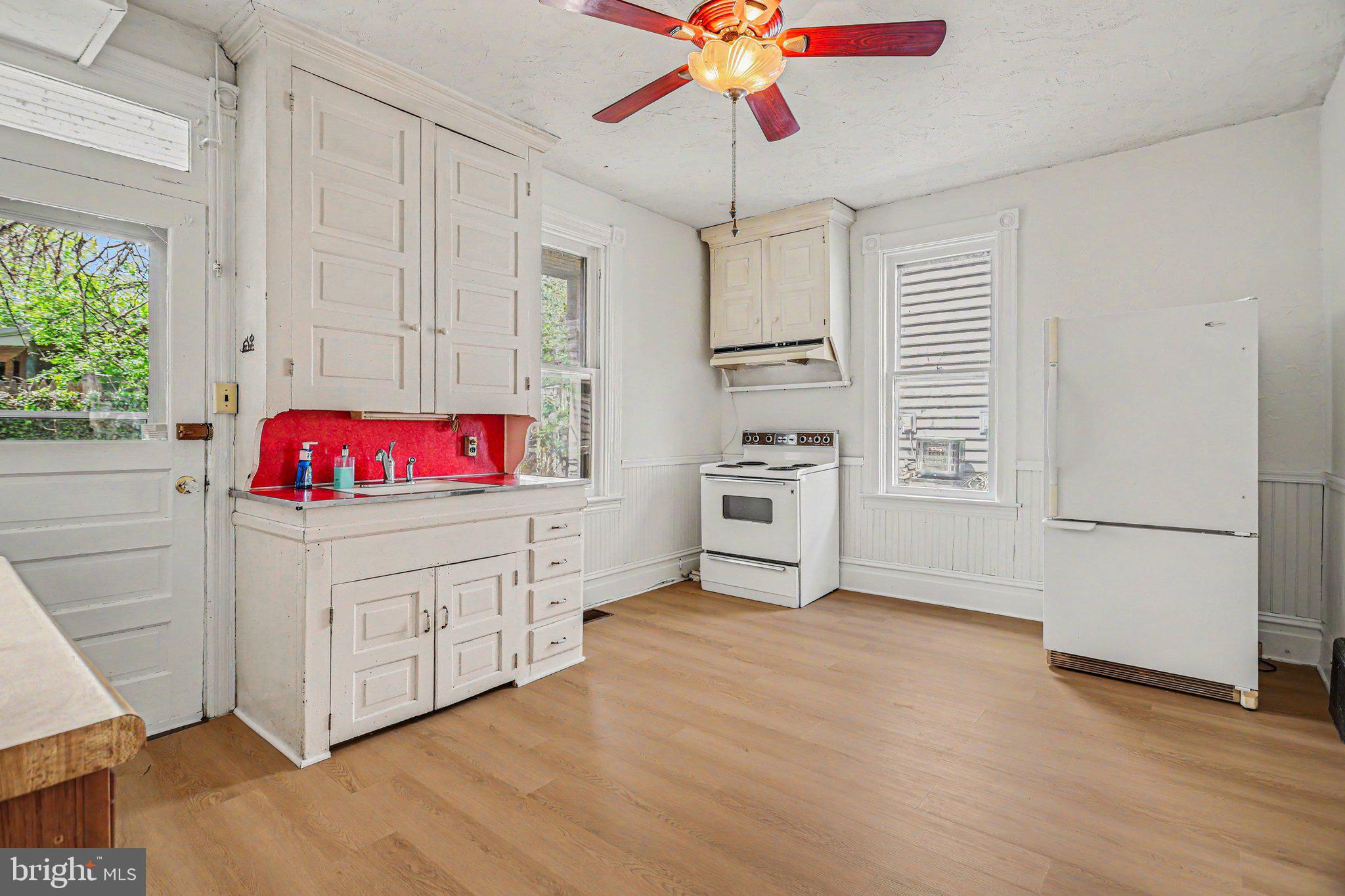 122 South Cedar Street Lititz, PA 17543 - Photo 9 of 23 a kitchen with stainless steel appliances cabinets and wooden floor