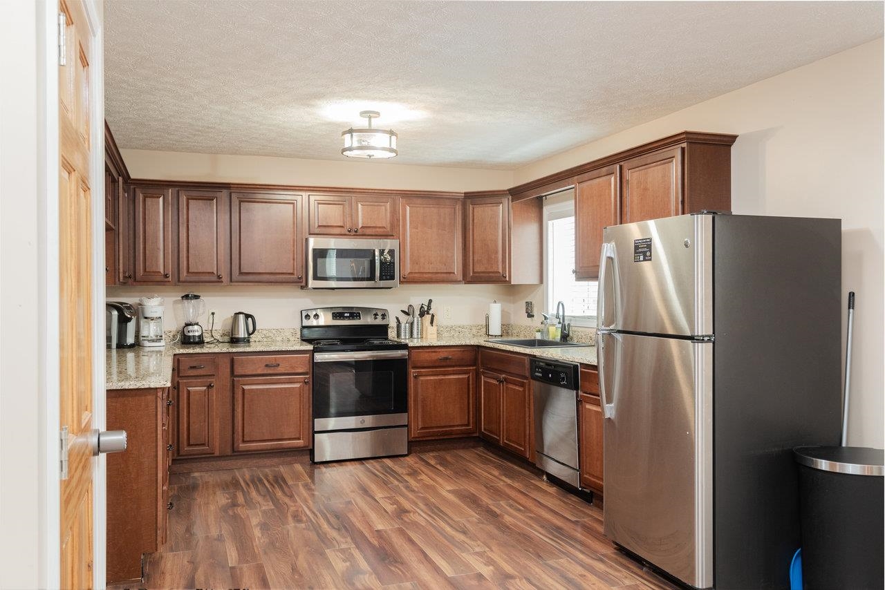 159 Park View Shenandoah, VA 22849 - Photo 11 of 70 a kitchen with granite countertop stainless steel appliances and wooden cabinets
