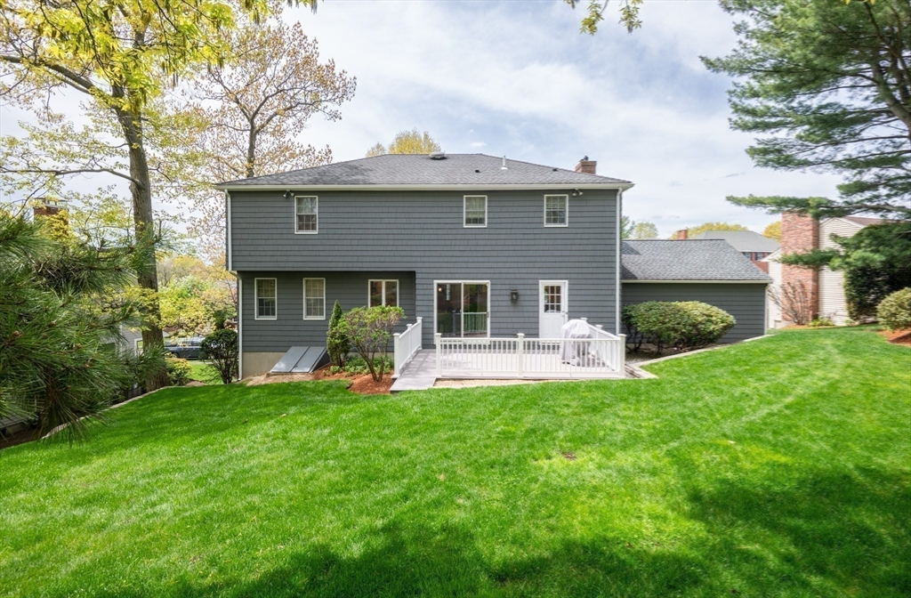 25 Ellen Road Stoneham, MA 02180 - Photo 34 of 41 a front view of a house with a garden and plants