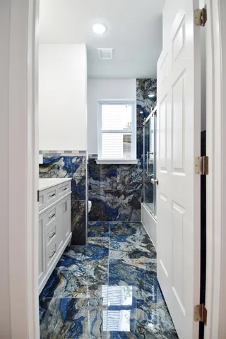 a bathroom with a sink and a mirror