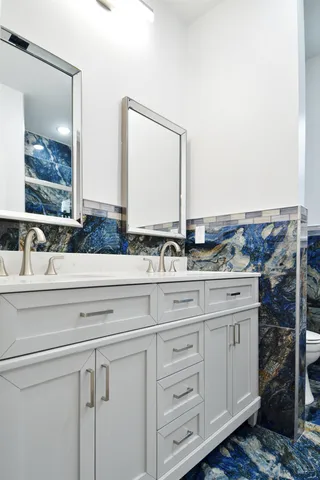 a bathroom with a bathtub and shower