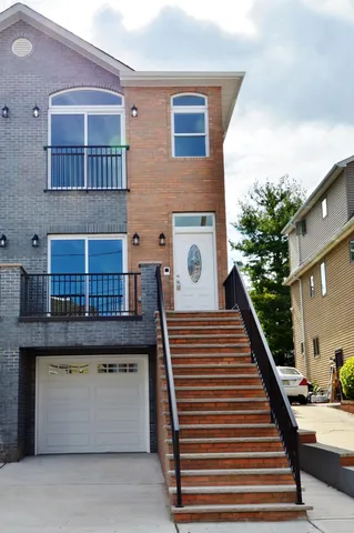 a view of kitchen with wooden floor and stainless steel appliances