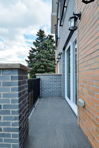 a large kitchen with stainless steel appliances granite countertop a stove and a sink