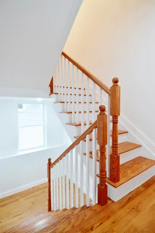 a bathroom with a double vanity sink mirror and shower