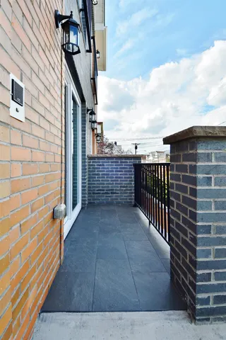 a view of kitchen with cabinets microwave and stove