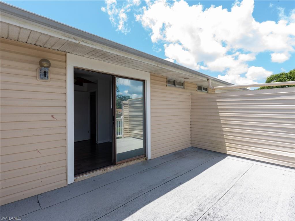 11001 Southeast Sunset Harbor Road, Unit 34 Summerfield, FL 34491 - Photo 21 of 31 View of patio / terrace