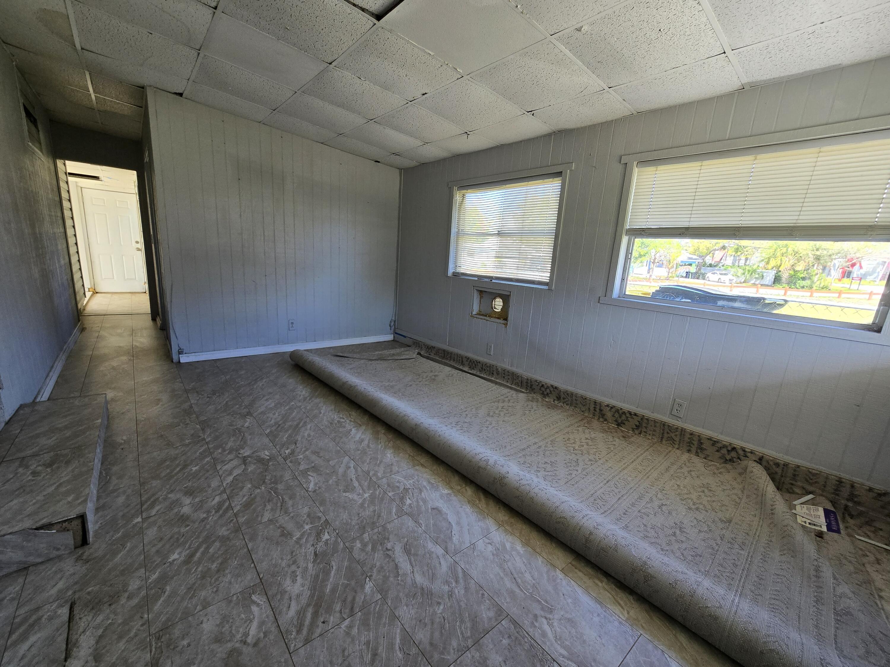 820 Southwest Palm City Road Stuart, FL 34994 - Photo 16 of 24 a view of an empty room and a window