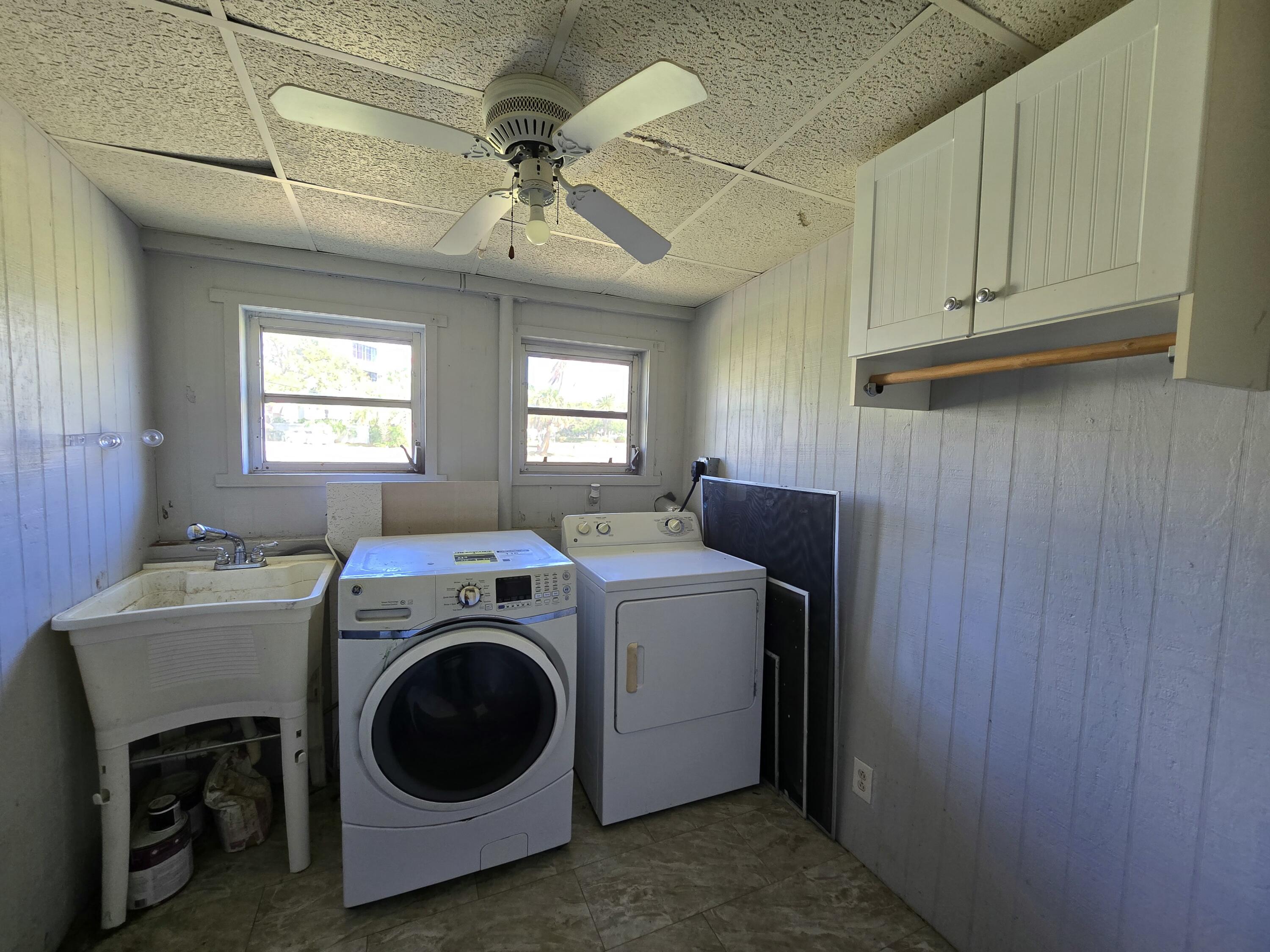 820 Southwest Palm City Road Stuart, FL 34994 - Photo 17 of 24 a utility room with dryer and washer