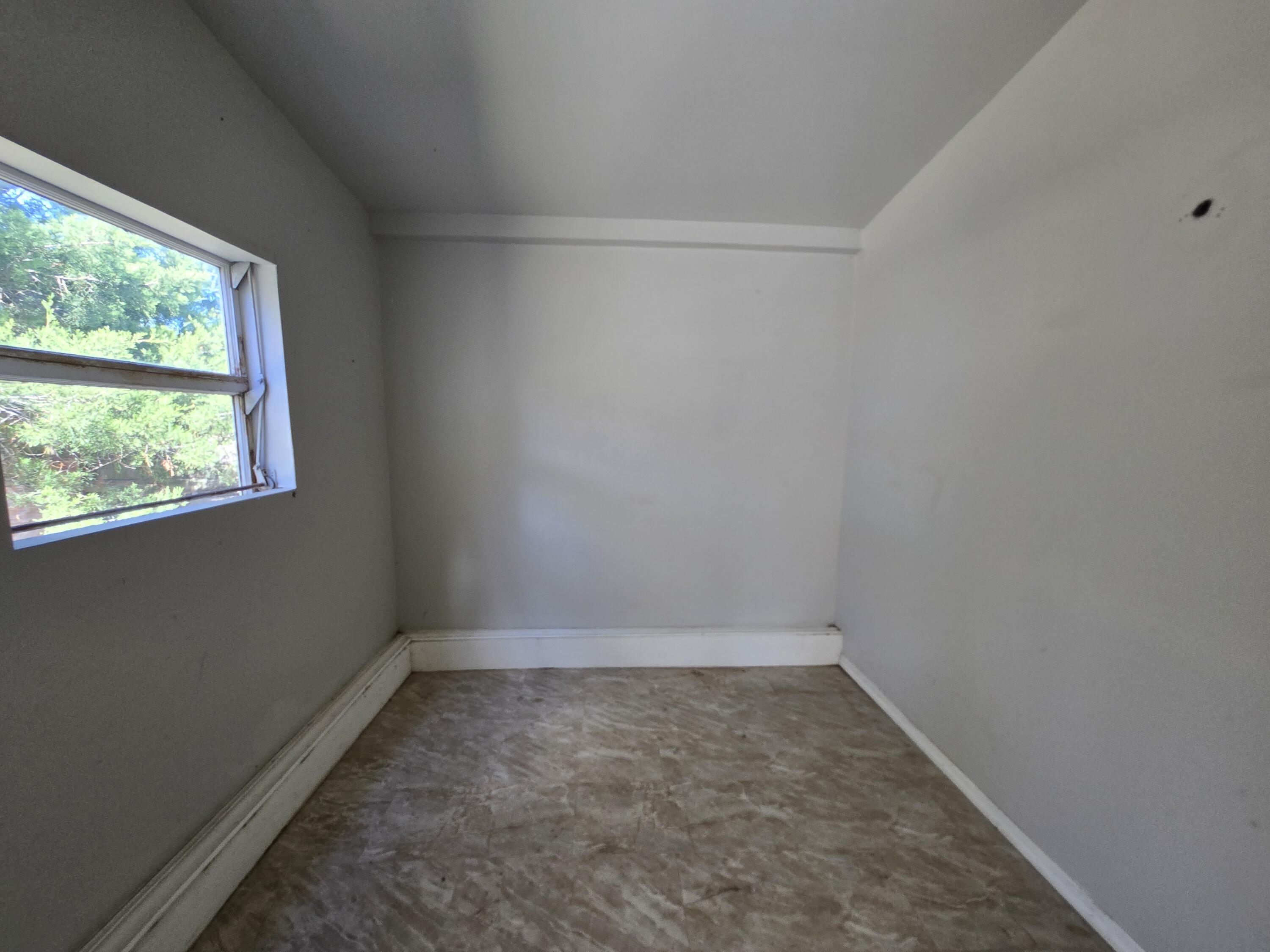 820 Southwest Palm City Road Stuart, FL 34994 - Photo 18 of 24 a room that has a window in it