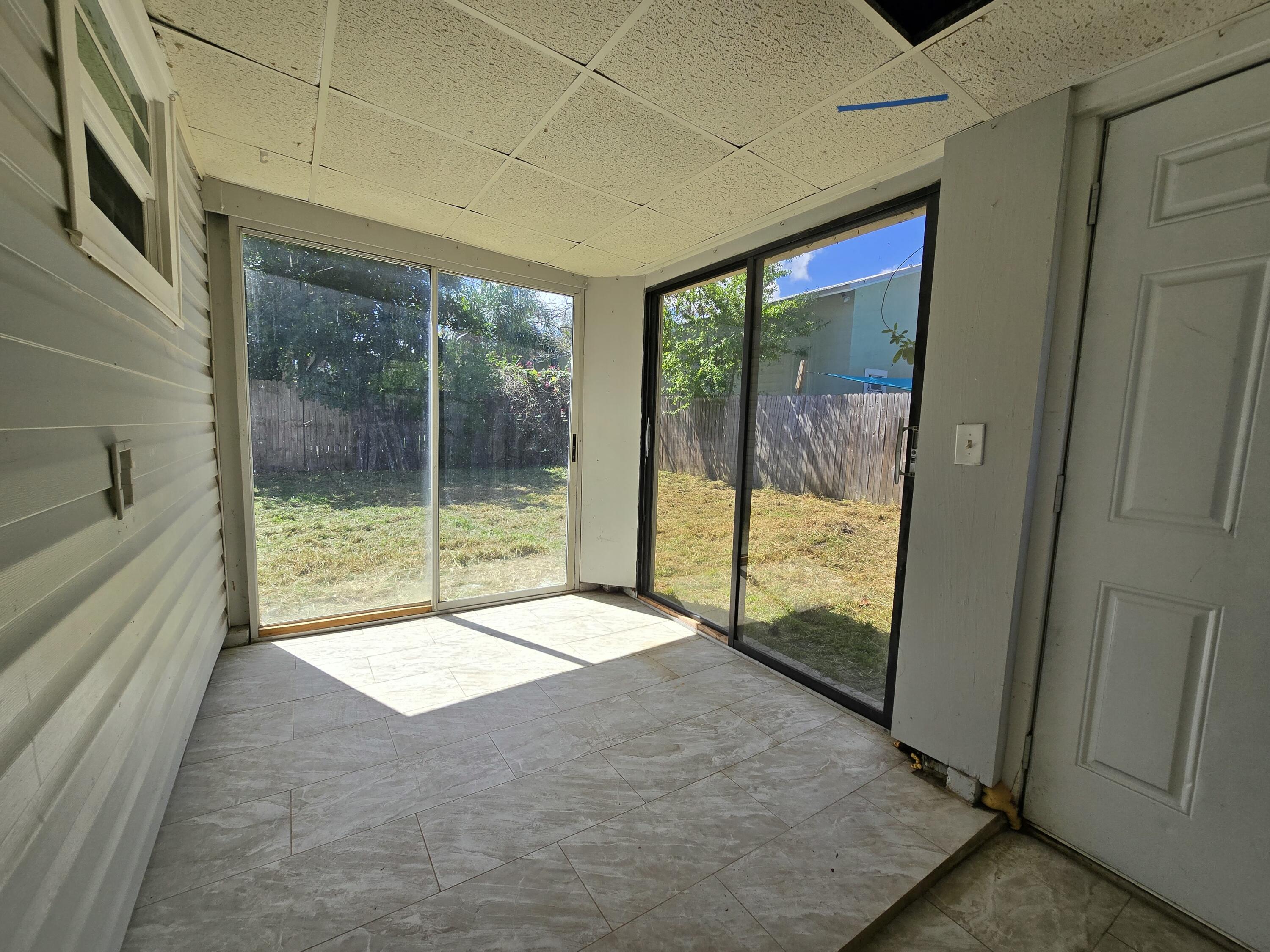 820 Southwest Palm City Road Stuart, FL 34994 - Photo 19 of 24 a view of an empty room and window