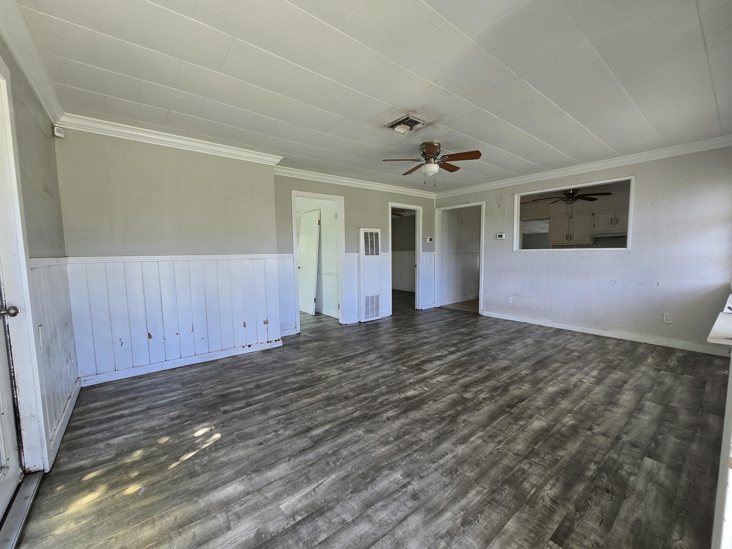 820 Southwest Palm City Road Stuart, FL 34994 - Photo 9 of 24 a view of a big room with wooden floor and windows