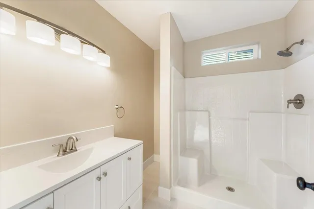 a bathroom with a bathtub and a sink