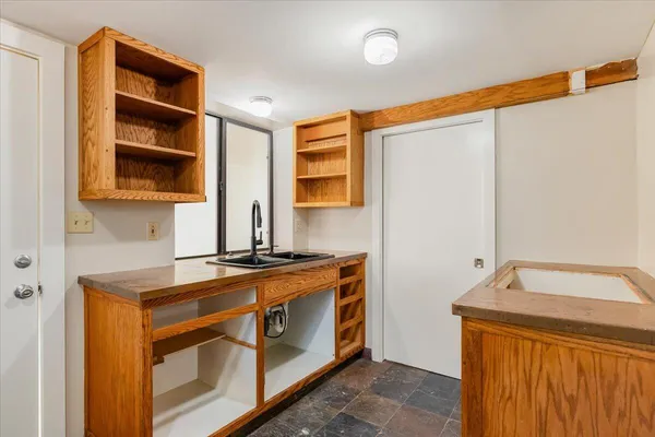 a kitchen with stainless steel appliances granite countertop a stove and a sink