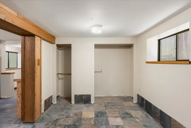 a view of a hallway with closet area
