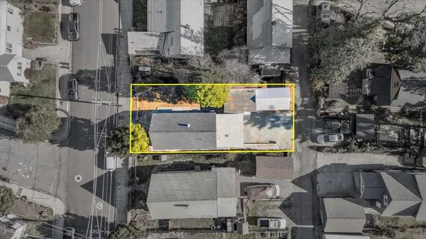 an aerial view of residential houses with outdoor space