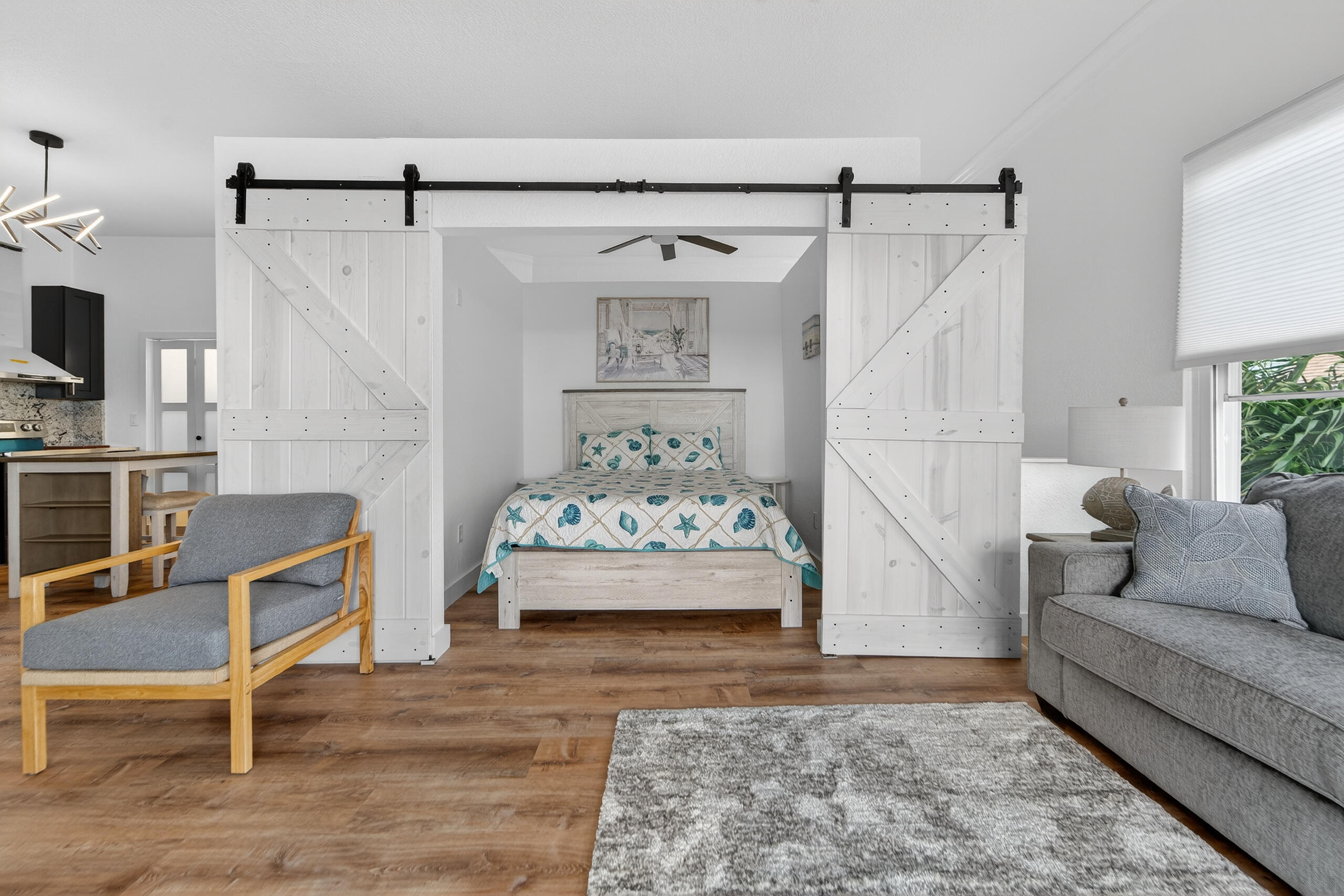 300 East 24th Street Riviera Beach, FL 33404 - Photo 11 of 19 a bedroom with a bed and a couch