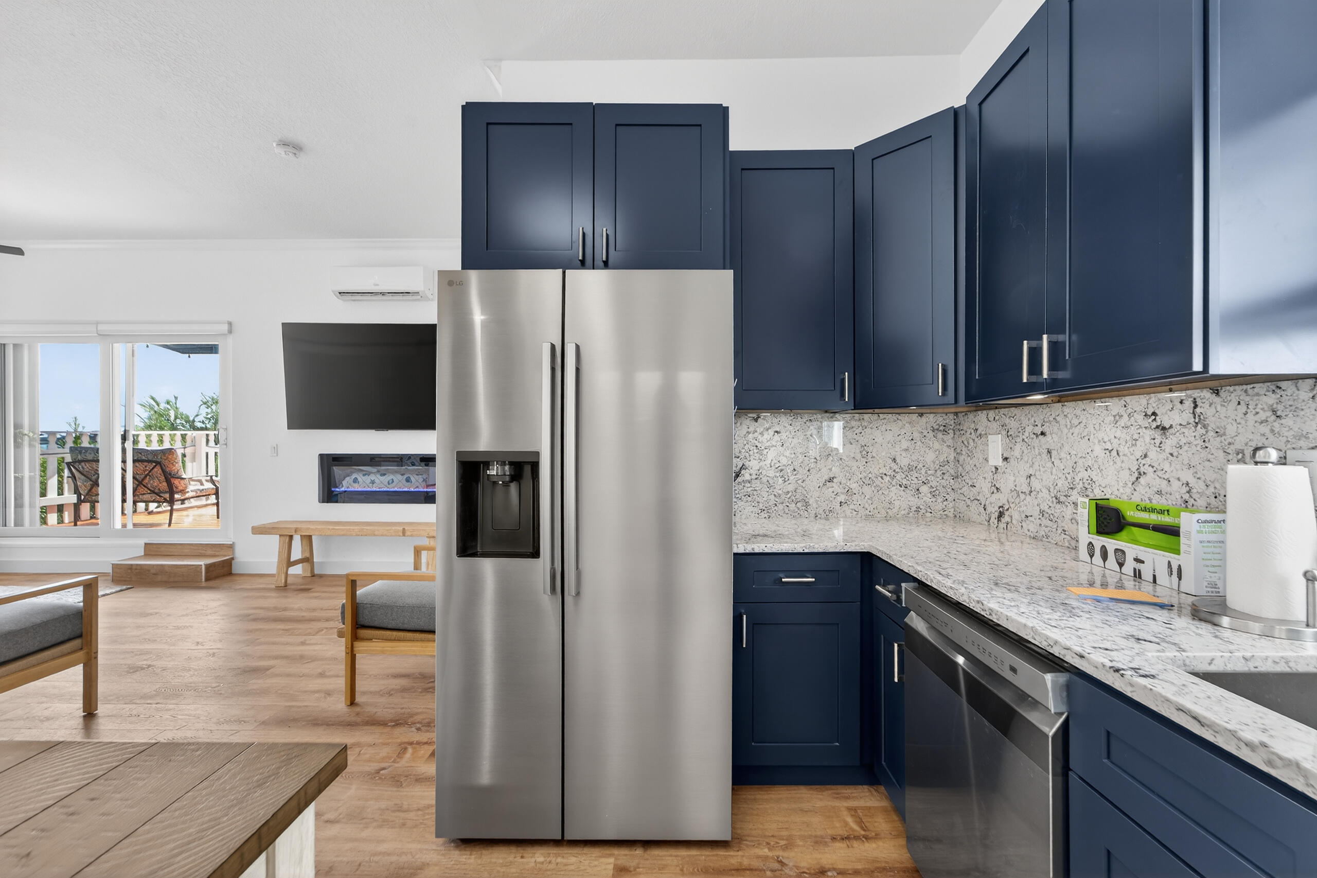 300 East 24th Street Riviera Beach, FL 33404 - Photo 8 of 19 a kitchen with a refrigerator and a sink