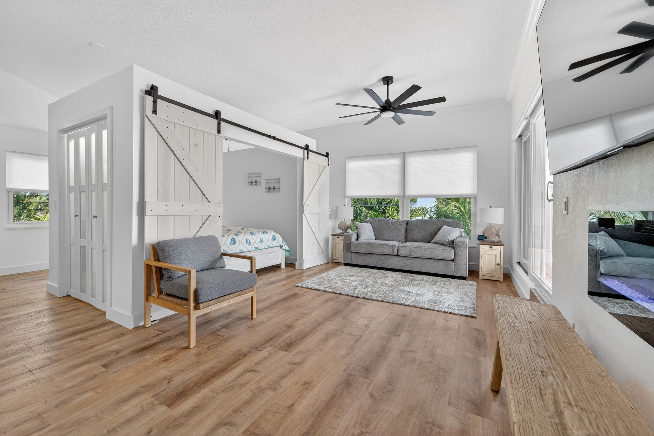 300 East 24th Street Riviera Beach, FL 33404 - Photo 9 of 19 a living room with furniture and a chandelier