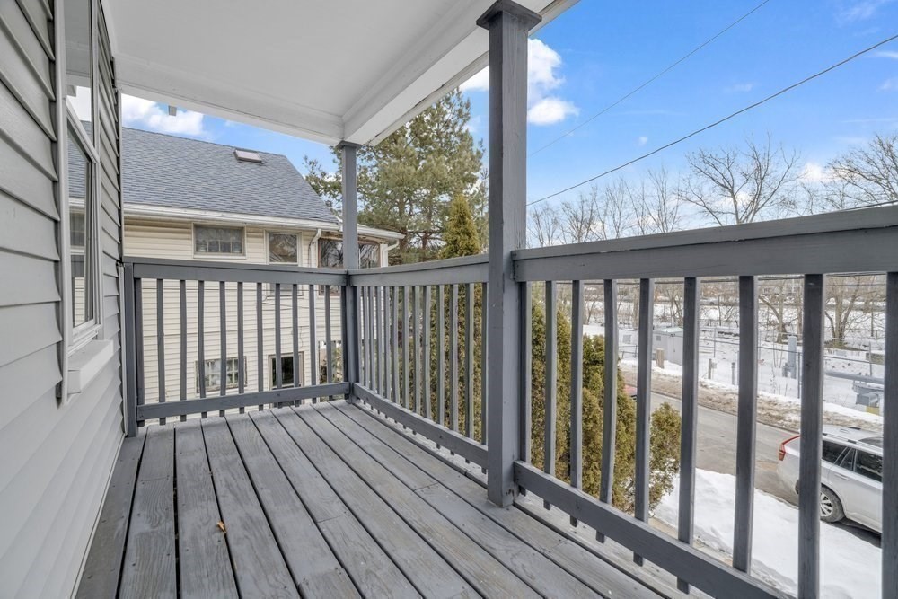 35 Boulevard Road, Unit 35 Arlington, MA 02474 - Photo 16 of 20 a balcony with wooden floor