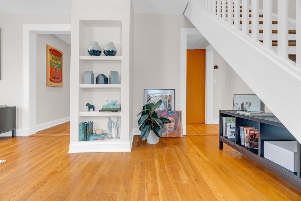 35 Boulevard Road, Unit 35 Arlington, MA 02474 - Photo 4 of 20 a living room with furniture and a wooden floor