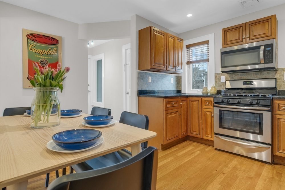 35 Boulevard Road, Unit 35 Arlington, MA 02474 - Photo 6 of 20 a kitchen with counter space appliances and wooden floor