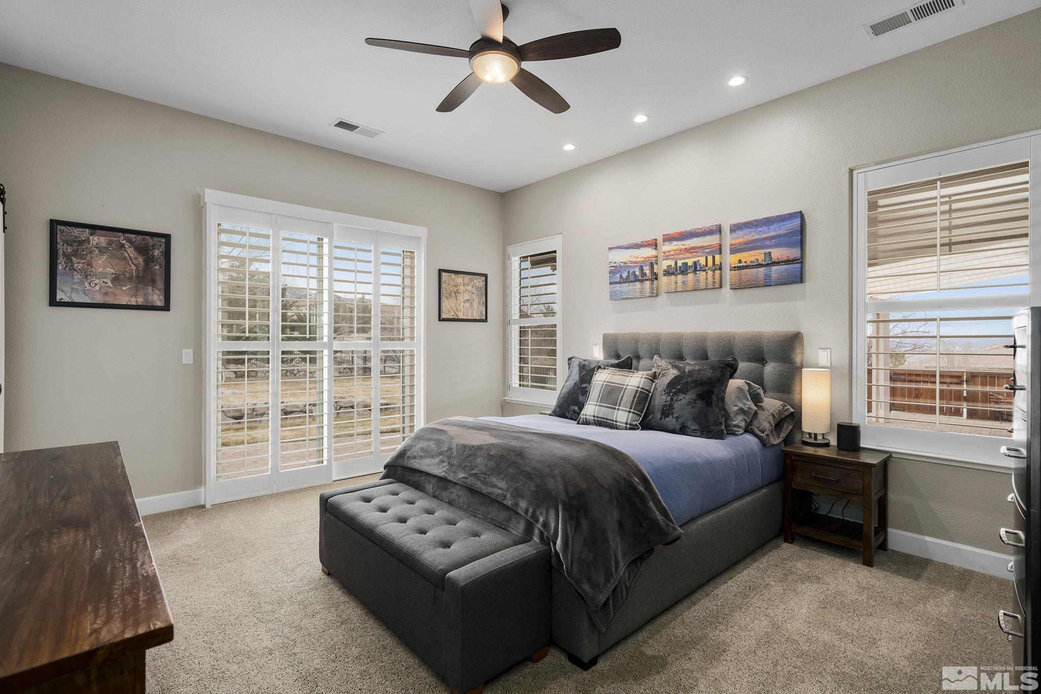 5630 North White Sands Road Reno, NV 89511 - Photo 16 of 40 a bedroom with a bed dresser and a window