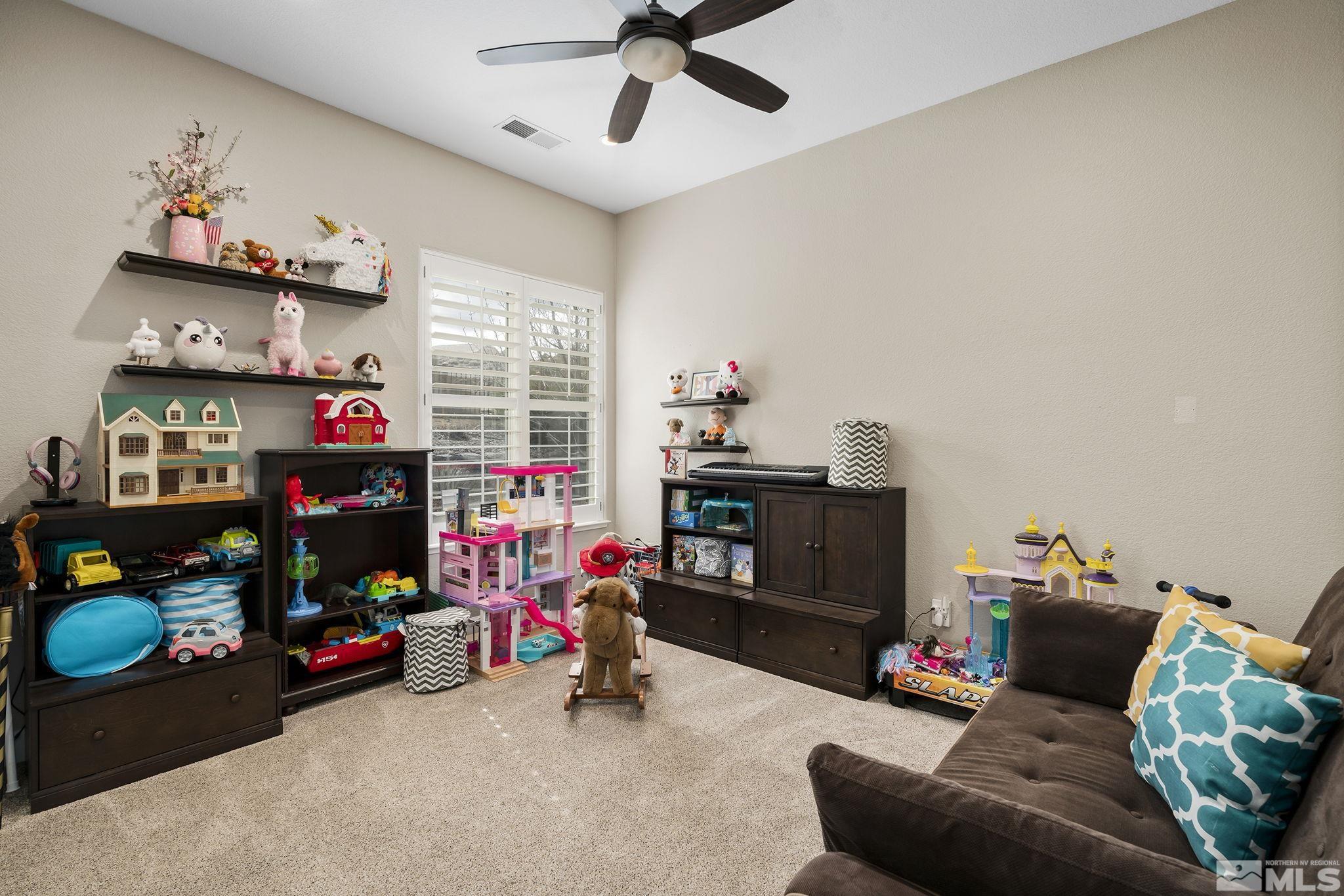 5630 North White Sands Road Reno, NV 89511 - Photo 20 of 40 a children room with toys and a fan