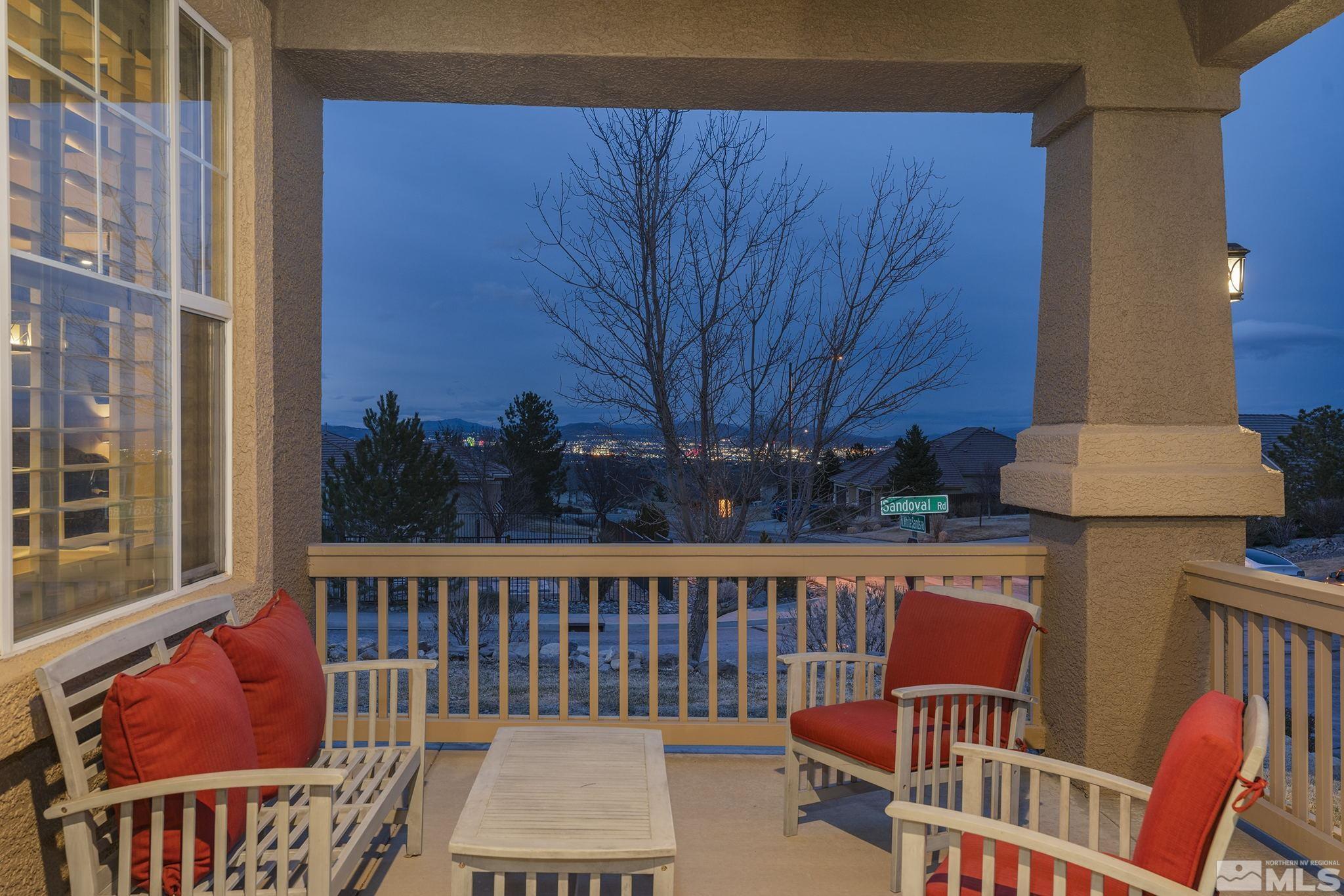 5630 North White Sands Road Reno, NV 89511 - Photo 2 of 40 a view of a chair and table in the balcony