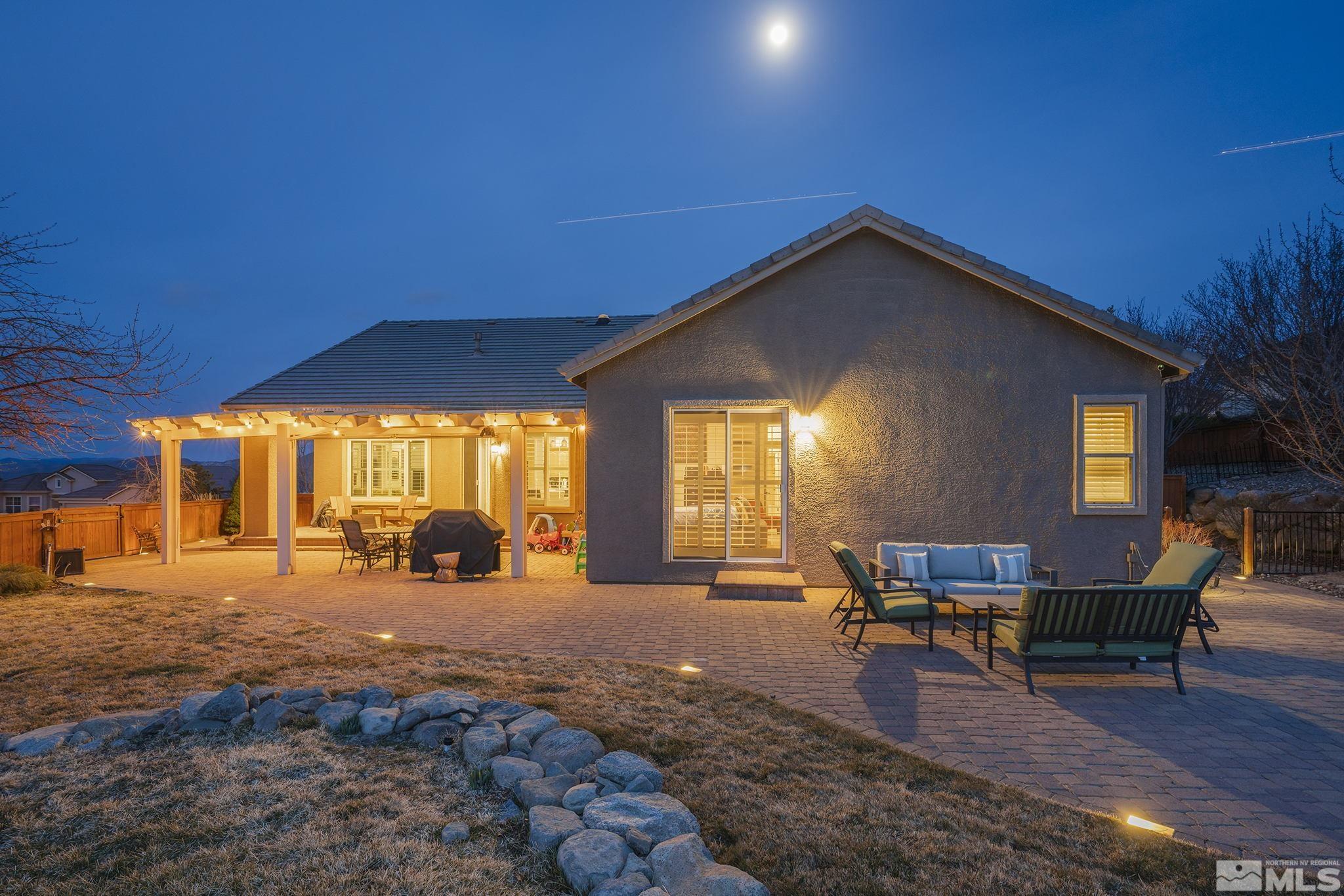5630 North White Sands Road Reno, NV 89511 - Photo 32 of 40 a view of a house with backyard porch and sitting area